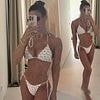 Rebekah Vardy shows off her toned physique in a tiny white bikini during family holiday