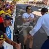 No-nonsense French security flips pro-Palestine protester trying to disrupt Tour de France over metal barrier