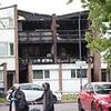 Three boys aged four, eight and 15 and 43-year-old woman are killed in house fire as police arrest man