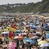 Sunseekers flock to beaches, parks and beauty spots as fourth heatwave of the year grips Britain with temperatures soaring to 30C