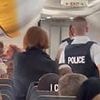 Dramatic moment police storm Ryanair jet after bomb threat forces major Belgian airport to suspend flights and set up security perimeter