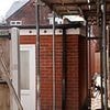 Locals on quiet cul-de-sac 'at their wits end' after neighbour turns back garden gym into home and moves a whole FAMILY in... and another adds an extra storey to their garage