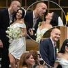 Charli XCX is married! Brat singer stuns in a leggy white mini dress and her trademark shades as she ties the knot with The 1975 star George Daniel - but bandmate Matty Healy is noticeably absent