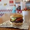 American divides opinion after claiming he was THROWN OUT of UK restaurant for eating a burger too slowly