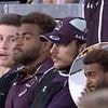 Broncos star cuts an awkward figure after being booed by fans as he returns to watch his team play following drug driving scandal