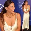 Braless Eva Longoria, 50, stuns in a daringly plunging silk gown as she attends charity gala in Marbella