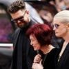 Watch: Sharon Osbourne cries as she views tributes to late husband Ozzy