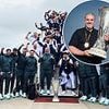 Tottenham stars pose with Europa League trophy after landing back in England - but who is the one player NOT smiling for the camera?