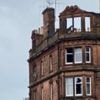 Man dies and girl, eight, hurt in top storey flat fire
