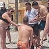 Incredible moment migrants are detained on Spanish beach after being tackled to the ground by tourists