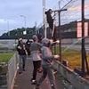 Horrifying moment football hooligans blast their rivals with fireworks and attack each other with sticks