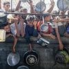 Israel lashes out at 'cynical' Gaza famine claims and releases video of food trucks as more than 100 international aid groups warn of 'mass starvation'