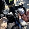 Instant karma as 'thief' is tackled by tourist who puts him in a chokehold after he 'tried to steal his camera' in Barcelona
