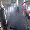 Terrifying moment jewel thief fired up smoke grenades in Claridge's and smashed his way into display case in £190,000 raid before hero security guard grabbed him