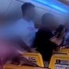 Footage shows chaos on board UK Ryanair flight as 'brawl sparked by crying baby sees police called and passengers held on the plane for an hour after landing'