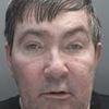 The Liverpool gangster so violent that prison guards are afraid to look him in the eye: Brutal crimes of notorious enforcer who scalped woman and slashed his OWN throat while on trial for murder