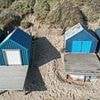 Tiny patch of sand on British beach with stunning panoramic views goes up for sale for staggering price - but you'll have to build your own hut to go with it