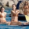 Lioness Lucy and her defeated Euros opponent have a ball... in matching her-and-hers bikinis