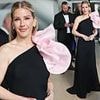 Ellie Goulding puts on an elegant display in striking black gown with dramatic pink bow as she steps out during Cannes Film Festival