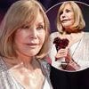 Kim Novak, 92, displays her incredibly smooth complexion at the Deauville American Film Festival in France as she accepts the Icon Award