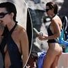 Emily Ratajkowski wows in very cheeky bikini as she dines on fries and beer on boat trip