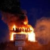 Burning of migrant boat effigy in Northern Ireland triggers police investigation