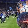 German fans STORM field in mass pitch-invasion with 'at least 25 hospitalised' after fallen giants secure Bundesliga return after seven years