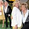 Rod Stewart, 80, puts on an animated display as he poses next to his glamorous wife Penny Lancaster, 54, at star-studded Mission: Impossible 8 premiere in London