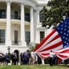 Watch: Donald Trump installs enormous US flags at the White House
