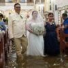 Why Filipino couples keep getting married in flooded churches
