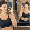 Michelle Keegan displays her toned figure and impressive abs as she poses in a sports bra during workout - four months after giving birth