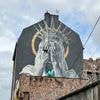 A new mural in France shows the Statue of Liberty covering her eyes in a swipe at Trump