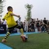 Photos show how humanoid robots captivate fans in China by playing a soccer match