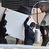 Chris Brown tries desperately to hide his face as he returns for show in Manchester a month after being arrested in the city over alleged nightclub bottle attack