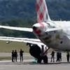 Man 'commits suicide' by 'throwing himself' into passenger jet engine after running on to the runway as plane prepared for take-off