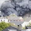 New footage of Tomorrowland inferno shows huge smoke cloud and fireworks going off over nearby houses as stage is completely destroyed just days before festival due to start