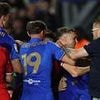 Shocking moment football thug tries to FIGHT opposition players during ugly brawl on opening game of the season - before being flatlined by security