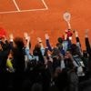 Opponents of French players at the French Open deal with insults and whistling and, yes, even gum