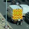 Moment wheelchair user shocks witnesses by clinging to moving police van in 'Back To The Future'-style stunt