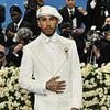 Met Gala 2025: Lewis Hamilton cuts a dapper figure in an eye-catching white suit and beret as he leads the British and Irish stars on the blue carpet