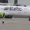 Moment man 'sprints across Heathrow tarmac as planes land' while airport staff chase him on foot
