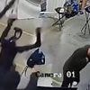 Chilling moment humanoid robot wakes up and starts attacking its handlers while trying to break free from restraints