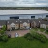 Our homes are dwarfed by 60ft tall monster ‘mega-sheds’ dubbed ‘Britain’s Berlin Wall’ – it’s taking all our sunlight
