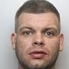 Thug, 31, who racially abused shopkeeper before pouring petrol over him and setting building alight is jailed for nine years