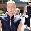 Lila Moss cuts a sophisticated figure in a chic navy dress as she arrives at Wimbledon for the men's singles final after enjoying Ibiza trip with mum Kate