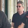 Noel Gallagher arrives for Oasis gig by train