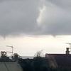 Ferocious storms lash Spain with 'two swept away' by flash floods, waterspouts lashing the coast and a woman struck by lightning… as wildfires close in on tourist hotspot