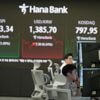 Asian shares track Wall Street's rally after Powell hints at rate cuts