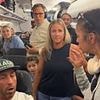 Ugly fight breaks out aboard plane after female lawyer is accused of skipping the line to disembark earlier
