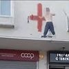 Man arrested after Muslim woman and her child were 'racially abused' by people painting flags on buildings